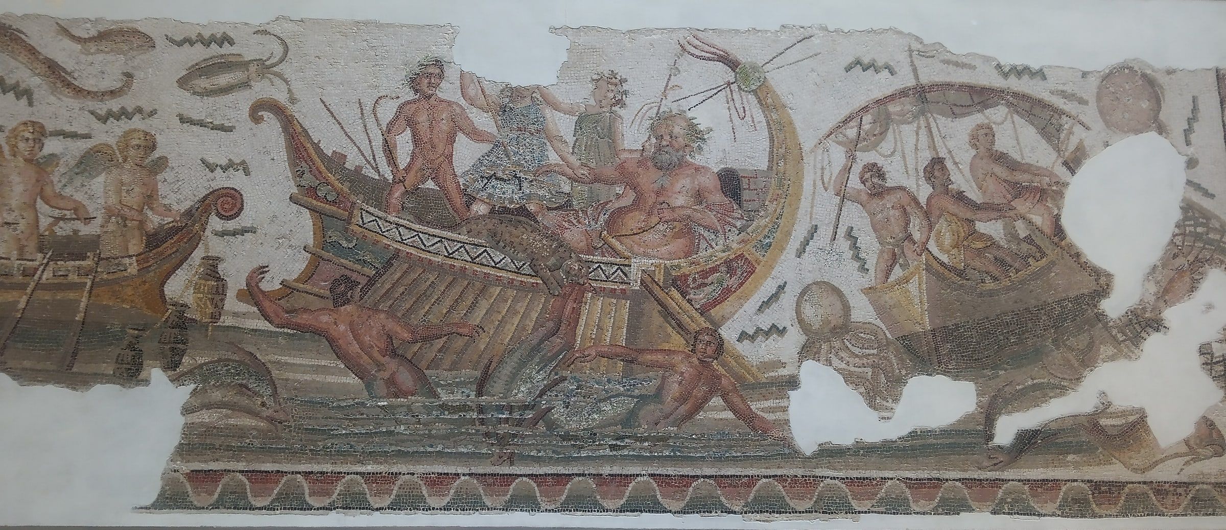 Roman mosaic of Dionysus standing in a ship while the pirates around him turn into dolphins